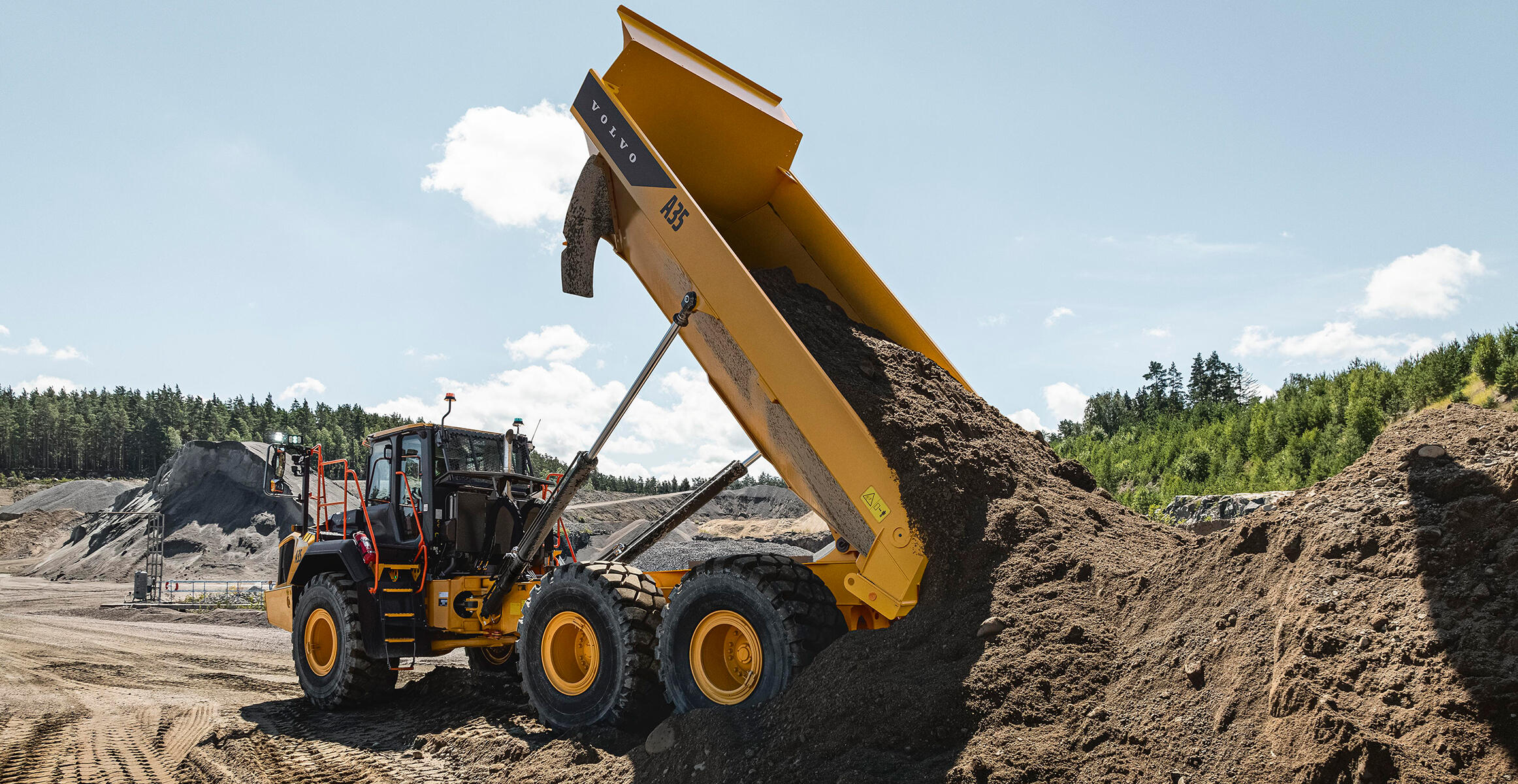 A Volvo A45 Articulated Hauler is tipping a load of earth in a construction site