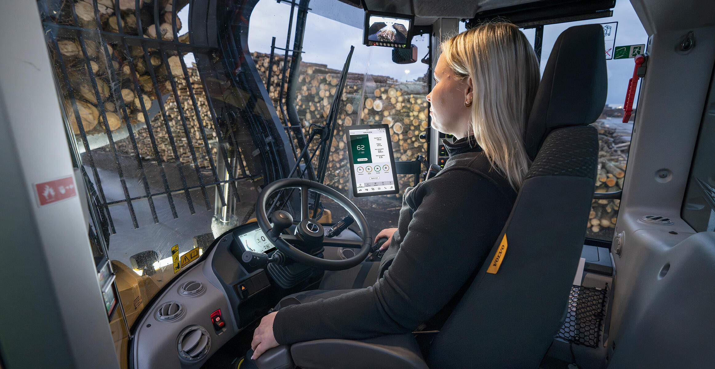 Inside cab of Volvo L200 High Lift wheel loader with Operator Coaching app on screen of Volvo Co-Pilot