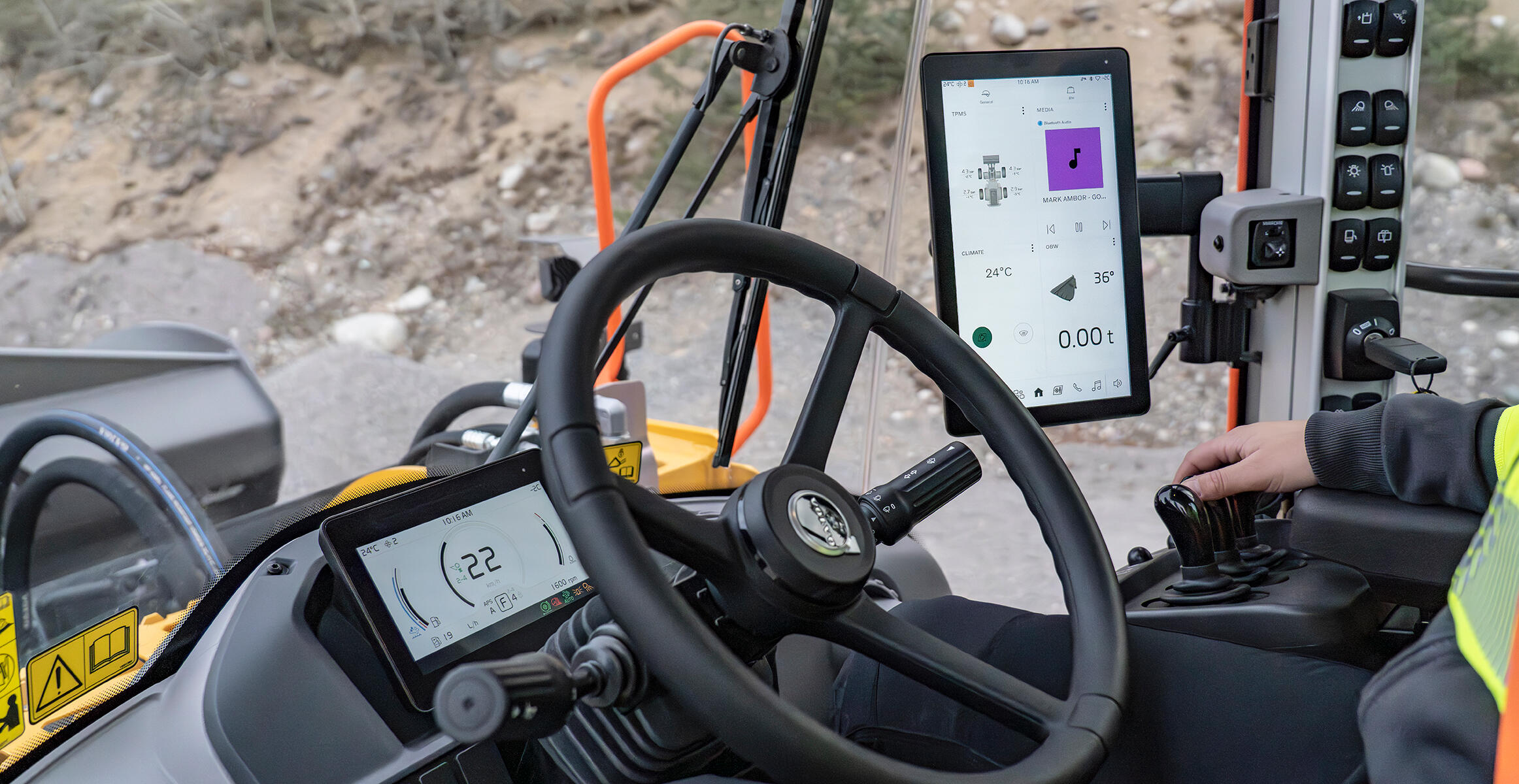Inside cab of Volvo wheel loader with close up of operator displays