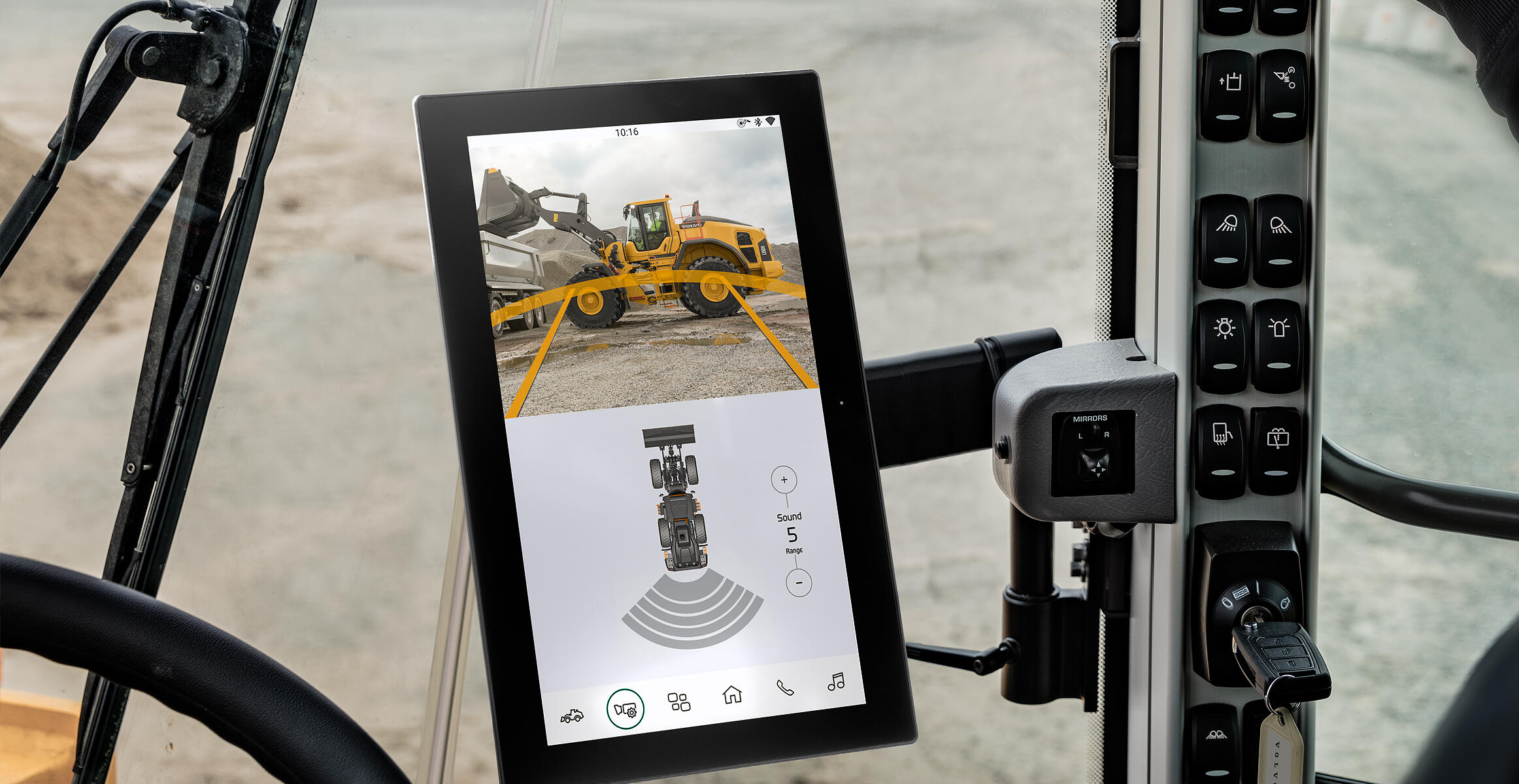 Volvo excavator camera view displayed on cab-mounted tablet with safety guidance overlay